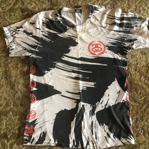 Stussy orange, black and white stripe shirt.